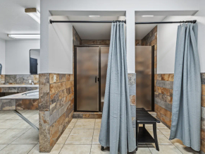 Shower stalls in the remodeled restrooms