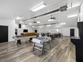 Clubhouse with a pool table, foosball and air hockey