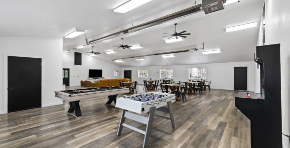 Clubhouse with a pool table and air hockey